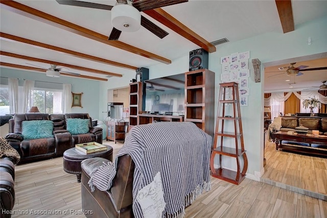 living room featuring beamed ceiling