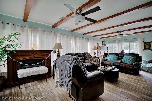 living room featuring beamed ceiling