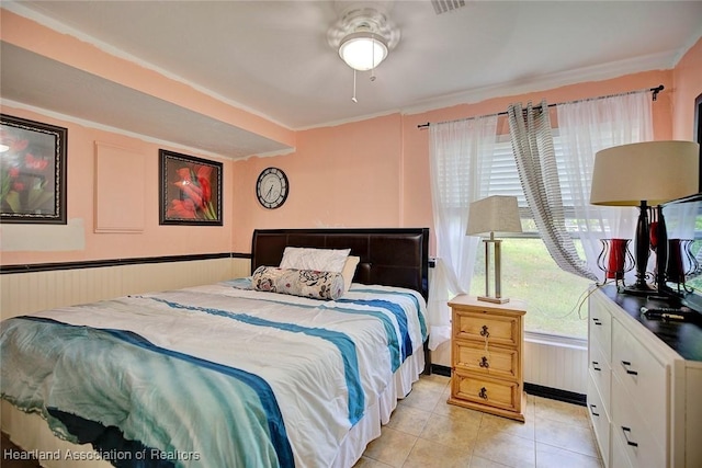 tiled bedroom with crown molding