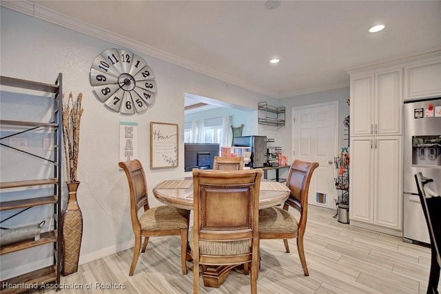 dining room featuring crown molding