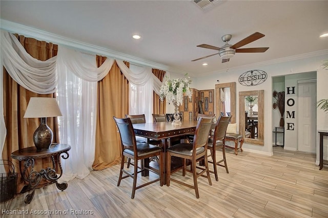 dining room featuring ceiling fan and crown molding