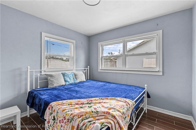 bedroom with multiple windows