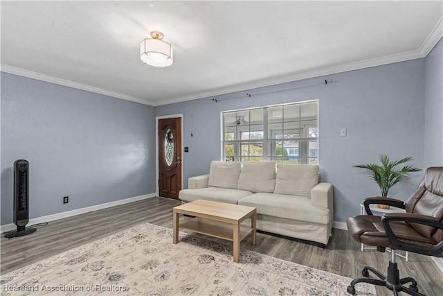 living room featuring crown molding, wood finished floors, and baseboards