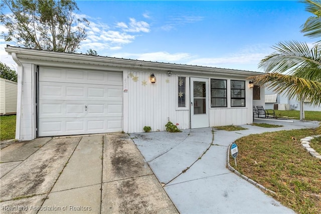 view of front of property featuring driveway and an attached garage