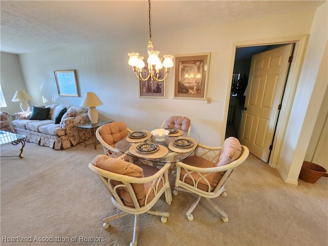 dining area with light carpet and a notable chandelier