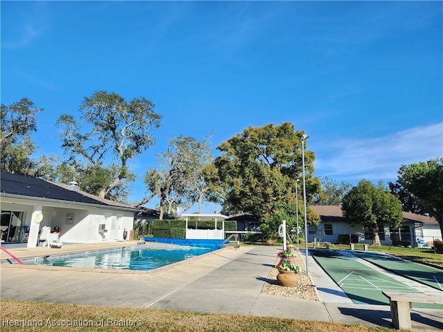 view of pool featuring a patio