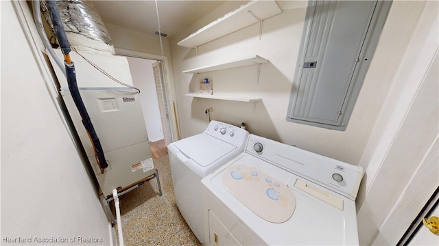 laundry area featuring laundry area, electric panel, and separate washer and dryer