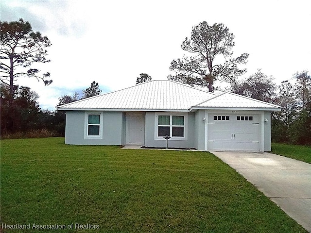 ranch-style home with a front yard, metal roof, and driveway