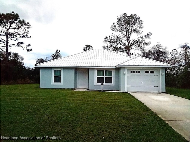 single story home with metal roof, concrete driveway, and a front yard