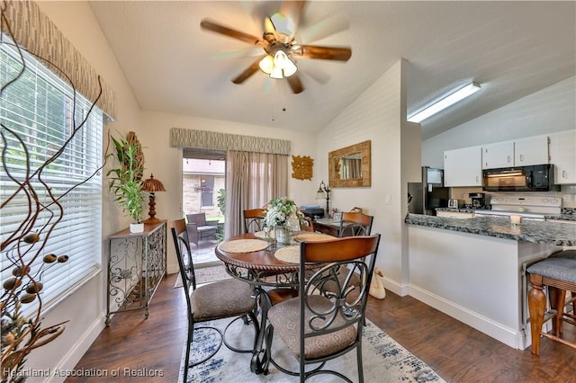 4212 Elson Ave, Sebring, FL 33875 - dining area featuring lofted ceiling, a ceiling fan, and dark wood finished floors