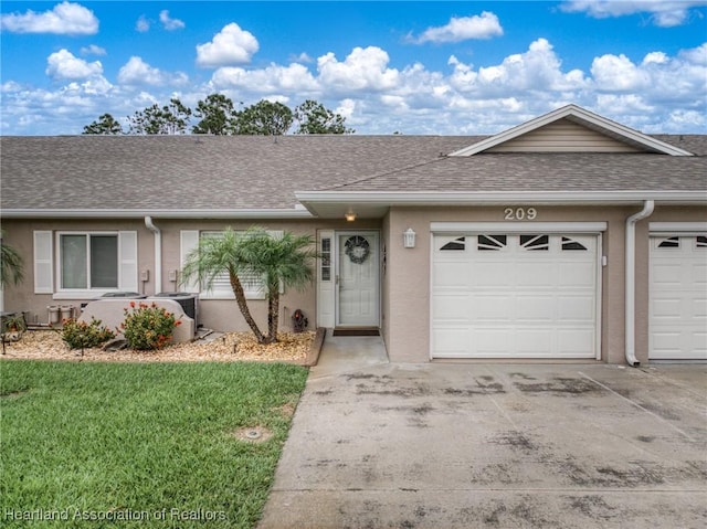 single story home featuring an attached garage, concrete driveway, stucco siding, a front lawn, and roof with shingles