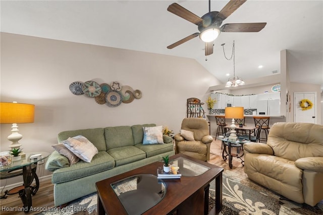 living room featuring a ceiling fan, vaulted ceiling, recessed lighting, wood finished floors, and baseboards