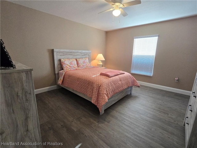 bedroom with ceiling fan and dark wood-type flooring