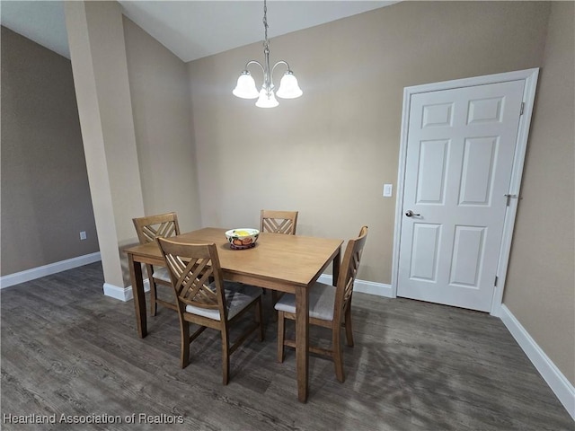 dining area with a chandelier and dark wood-type flooring