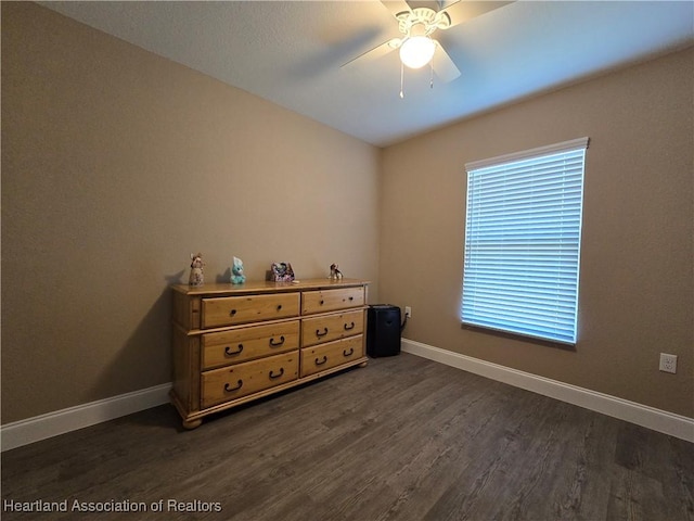 bedroom featuring ceiling fan and dark hardwood / wood-style floors