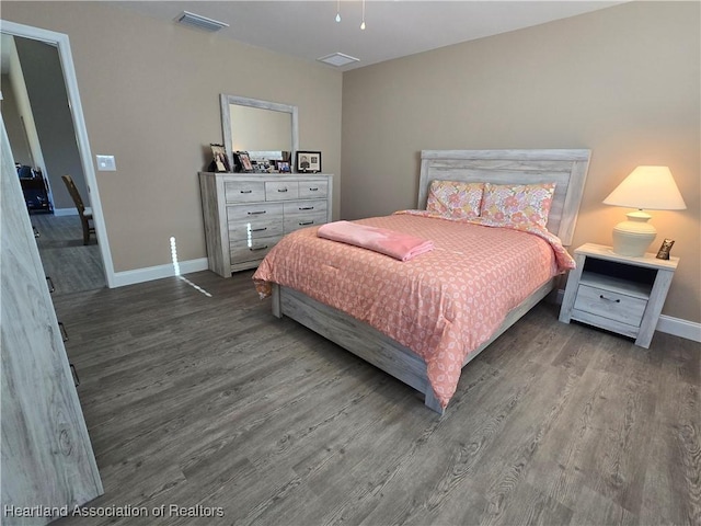 bedroom with wood-type flooring