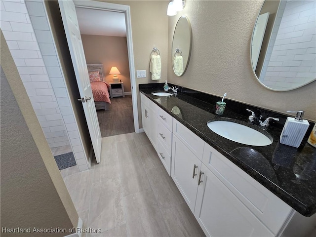 bathroom with wood-type flooring and vanity