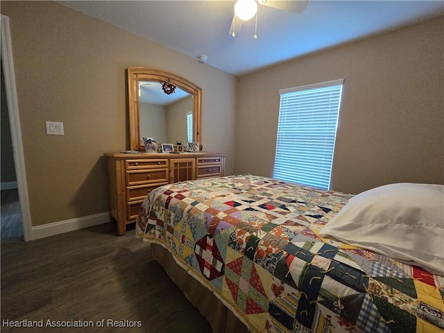 bedroom featuring ceiling fan and dark hardwood / wood-style floors