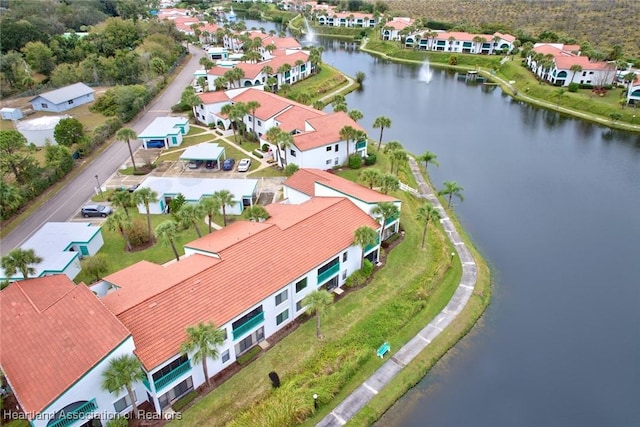 bird's eye view featuring a residential view and a water view