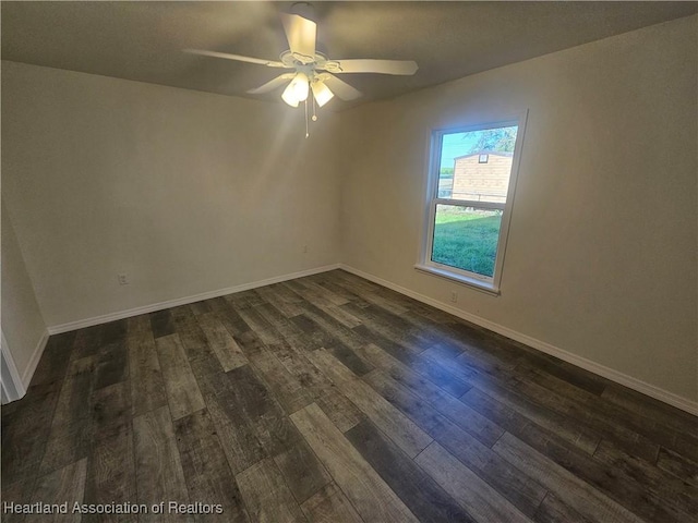 1703 N Morningside Rd, Avon Park, FL 33825 - empty room featuring dark wood-style floors, ceiling fan, and baseboards