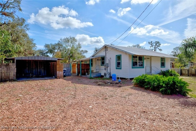 exterior space featuring covered porch and a carport