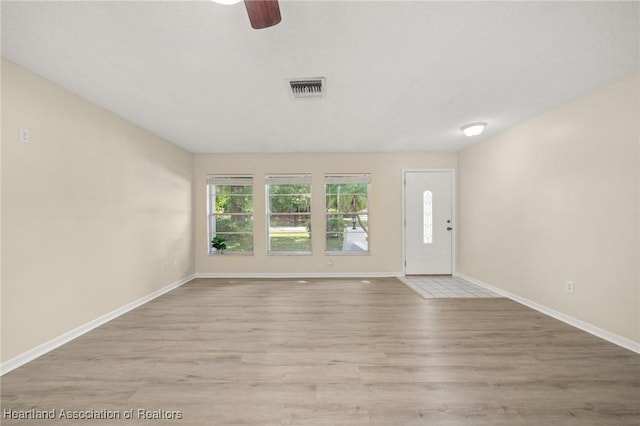 4304 Lewis Ave, Sebring, FL 33875 - foyer entrance with a ceiling fan and wood finished floors