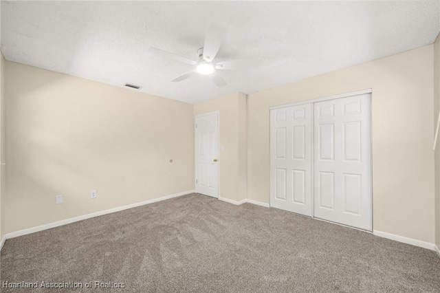 4304 Lewis Ave, Sebring, FL 33875 - unfurnished bedroom with carpet, a closet, a ceiling fan, and a textured ceiling