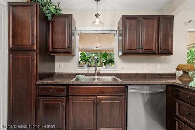 4304 Lewis Ave, Sebring, FL 33875 - kitchen with dishwasher, dark brown cabinetry, decorative light fixtures, and dark stone countertops