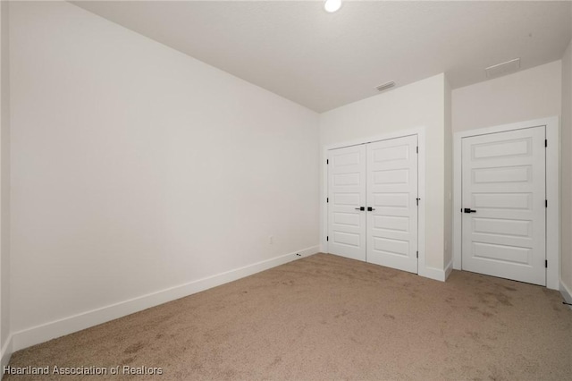5243 Cortez Blvd, Sebring, FL 33872 - unfurnished bedroom featuring carpet, baseboards, and a closet