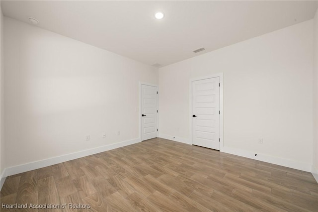 5243 Cortez Blvd, Sebring, FL 33872 - empty room with light wood-style floors, baseboards, and recessed lighting