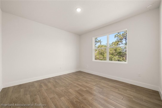 5243 Cortez Blvd, Sebring, FL 33872 - spare room with baseboards, wood finished floors, and recessed lighting