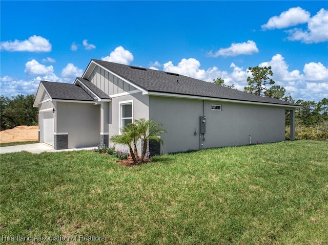 5243 Cortez Blvd, Sebring, FL 33872 - view of side of property with an attached garage, a yard, stucco siding, and a shingled roof
