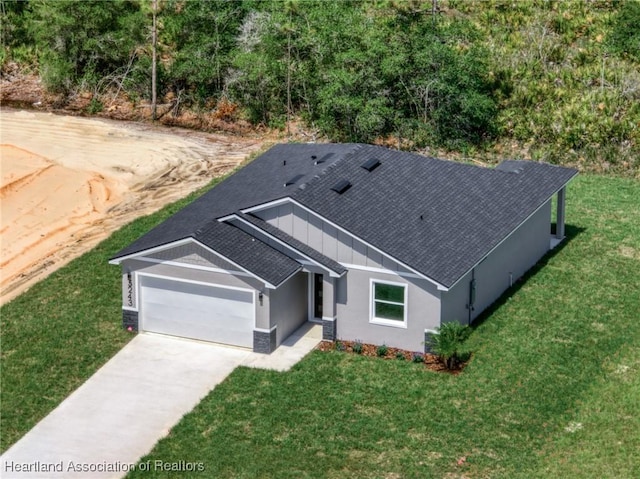 5243 Cortez Blvd, Sebring, FL 33872 - view of front of house featuring a shingled roof, a garage, and a front lawn