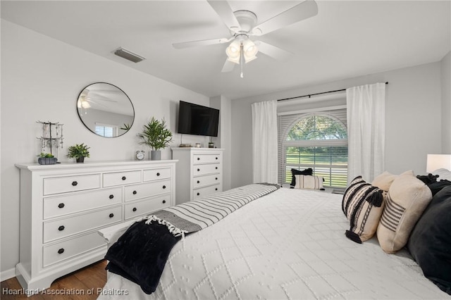 bedroom featuring dark hardwood / wood-style flooring and ceiling fan