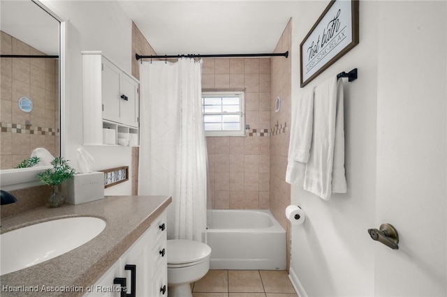 full bathroom featuring tile patterned flooring, vanity, shower / tub combo with curtain, and toilet