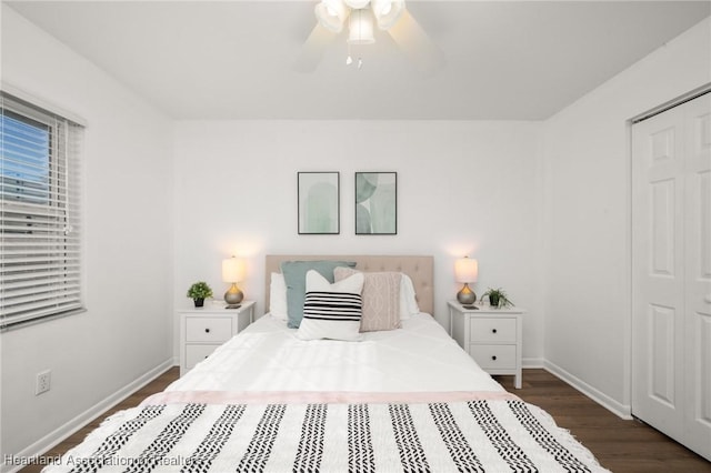 bedroom featuring dark hardwood / wood-style flooring, ceiling fan, and a closet