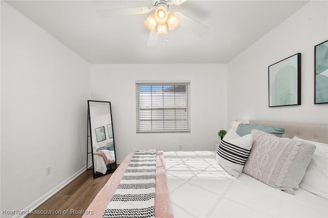 bedroom with hardwood / wood-style floors and ceiling fan