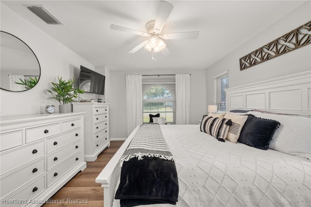 bedroom featuring ceiling fan and dark wood-type flooring