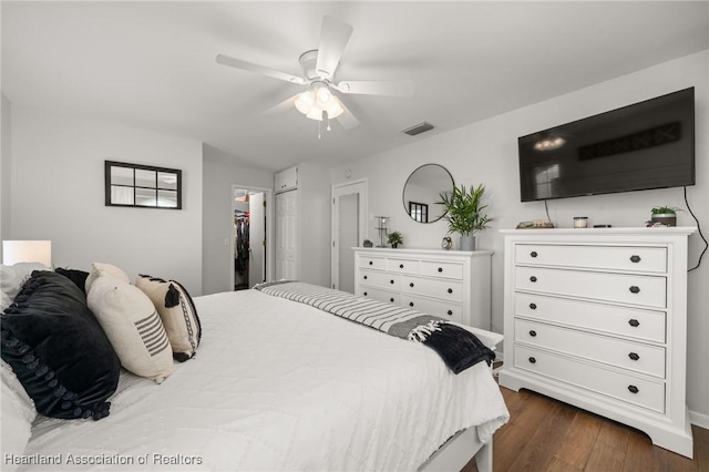 bedroom featuring ceiling fan and dark wood-type flooring