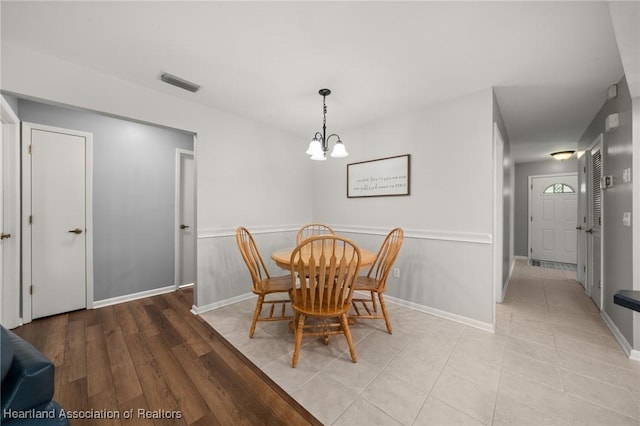 dining area featuring an inviting chandelier