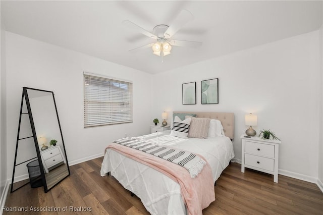 bedroom featuring ceiling fan and dark hardwood / wood-style floors