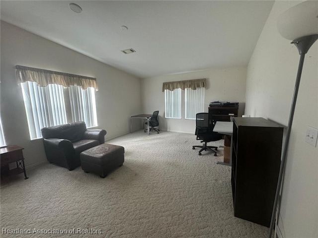 carpeted home office featuring a healthy amount of sunlight and lofted ceiling