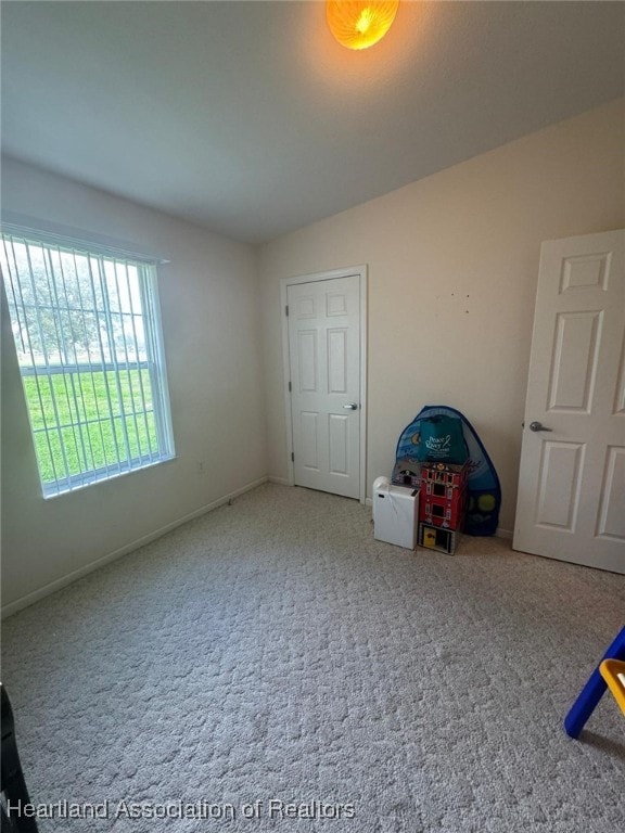 unfurnished bedroom with carpet flooring