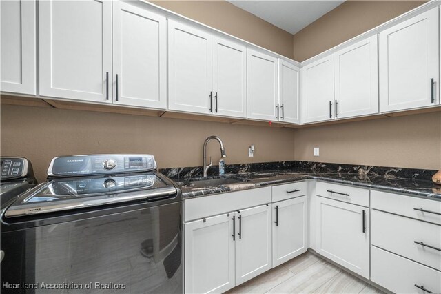 500 Heartland Blvd, Lake Placid, FL 33852 - clothes washing area with washer and clothes dryer and cabinet space