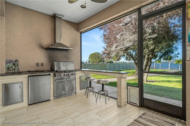 500 Heartland Blvd, Lake Placid, FL 33852 - kitchen with fridge, wall chimney range hood, a textured wall, and a sink