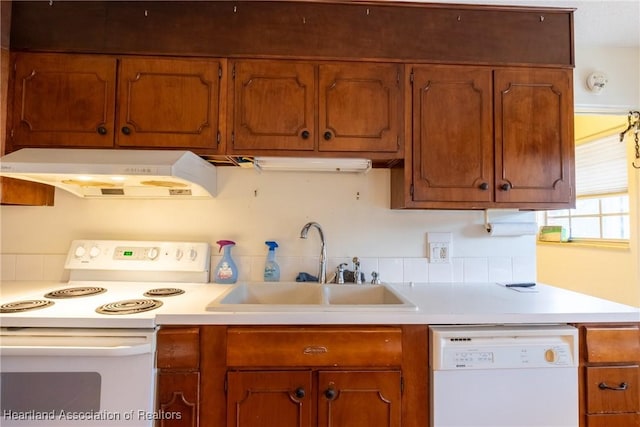 kitchen featuring sink and white appliances