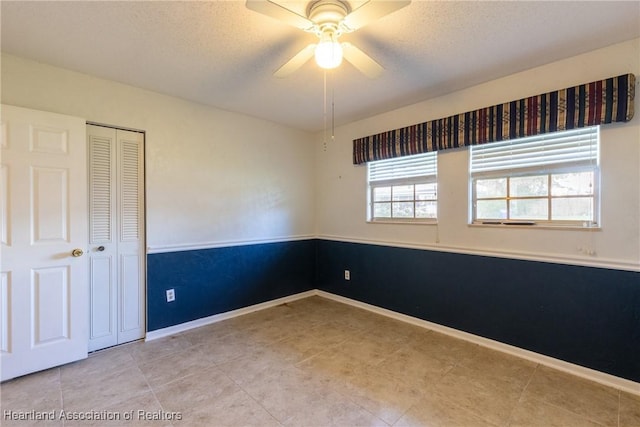 spare room featuring ceiling fan