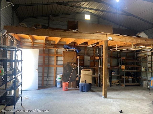 garage featuring wood walls