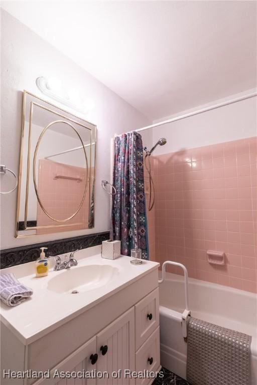 bathroom with vanity and shower / tub combo