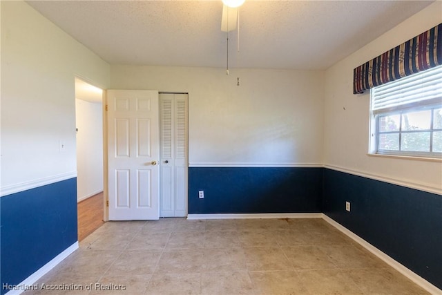 spare room with ceiling fan